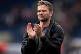 Tom Cleverley applauds the fans