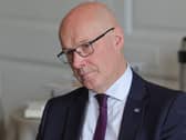 John Swinney tilting his head to one side