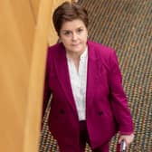 Former first minister Nicola Sturgeon leaves the chamber for the last time as an MSP