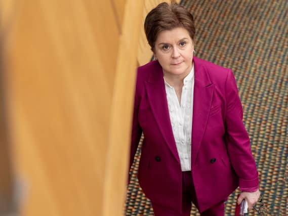 Former first minister Nicola Sturgeon leaves the chamber for the last time as an MSP