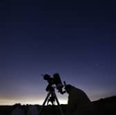 Members of the York Astronomical Society prepare to view the annual Perseids meteor shower in the village of Rufforth, near York, northern England on 12 August 2015.