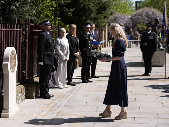 Andrew Harper’s widow Lissie Harper lays a wreath at a memorial stone in Reading