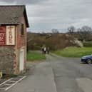 Access to the affordable home site at Caemawdy, Bronllys is down this track past the Honey Café. From Google Streetview.