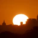 The sun rises over buildings in London