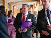 Joe Fagan walking through a corridor at Holyrood