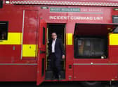 Prime Minister Andy Burnham steps out of a West Midlands Fire Service incident command unit