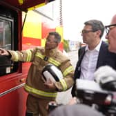 Prime Minister Andy Burnham speaking to emergency responders at the West Midlands Fire Service incident command unit during a visit to Stourbridge