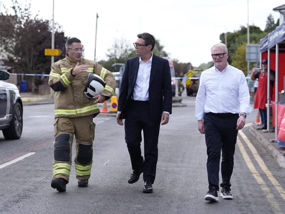 Prime Minister Andy Burnham and West Midlands Mayor Richard Parker (right) speaking to West Midlands Fire Service Chief fire officer Simon Tuhill in Stourbridge following a major wildfire near the town