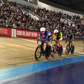 Finlay Tarling riding in a line of cyclists at the National Track Championships in the Manchester Velodrome