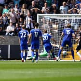 Conor Grant, third from left, scores for Notts County