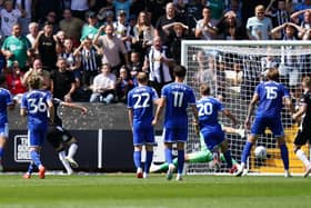 Conor Grant, third from left, scores for Notts County