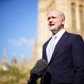 Stephen Flynn speaking to the media outside the Houses of Parliament