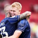 Josh Coburn (right) and Lyndon Dykes celebrate