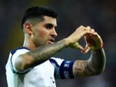 Cristian Romero makes a heart shape with his hands