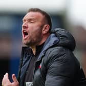 Blackpool boss Ian Evatt shouts from the side of the pitch