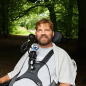 Danny Mavor smiling, in woodland