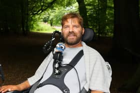 Danny Mavor smiling, in woodland