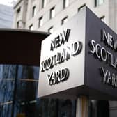 New Scotland Yard sign outside the Metropolitan Police headquarters in London