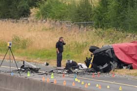 Suitcases by one of the vehicles at the scene on the M9 northbound at junction 3 in Co Kildare
