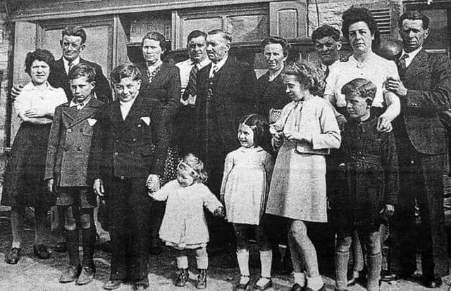 The Osmont family in France, with Hortense on the far left with (presumably) Louis behind her.  