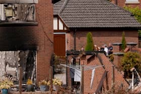 Housing Secretary Angela Rayner views the burnt-out remains of houses on Quarry Park Road in Stourbridge.