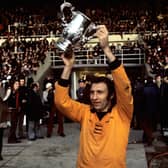 Victorious Wolverhampton Wanderers captain Mike Bailey holds the League Cup aloft in 1974