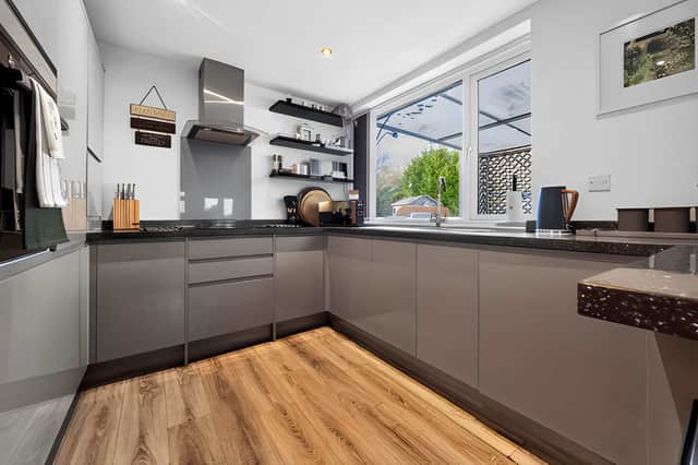 The modern kitchen forms part of the bright open-plan layout, keeping the main living space practical and sociable