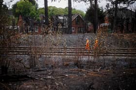 Network rail workers inspect the track and embankment after the Stourbridge wildfire 