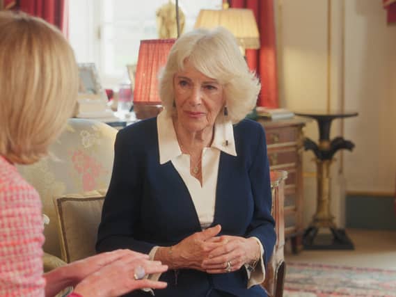 The Queen sitting in Clarence House speaking during filming