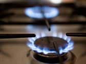 Gas hob in use with gas flame