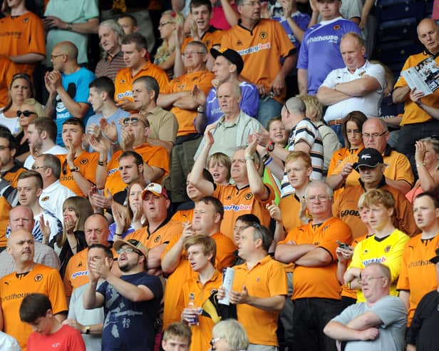 John Bray in the middle of a packed out away end at Deepdale