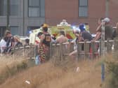 Emergency services and local people at the scene of the incident
