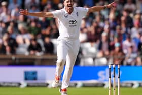 Josh Tongue celebrates a wicket