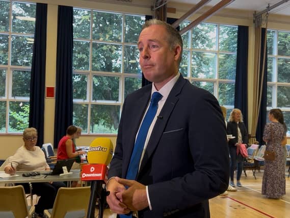 Paul Givan in a school hall