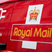 A Royal Mail logo on a van