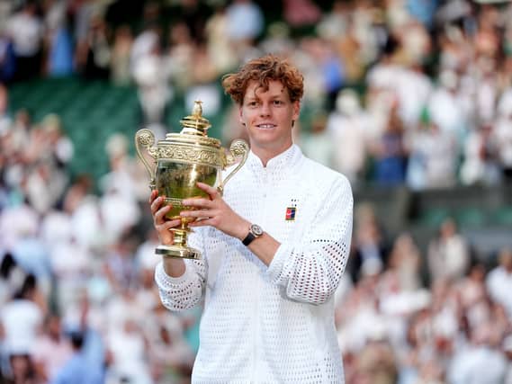 Jannik Sinner holds the Wimbledon trophy