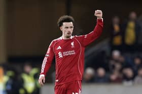 Curtis Jones raises his fist to acknowledge the Liverpool fans
