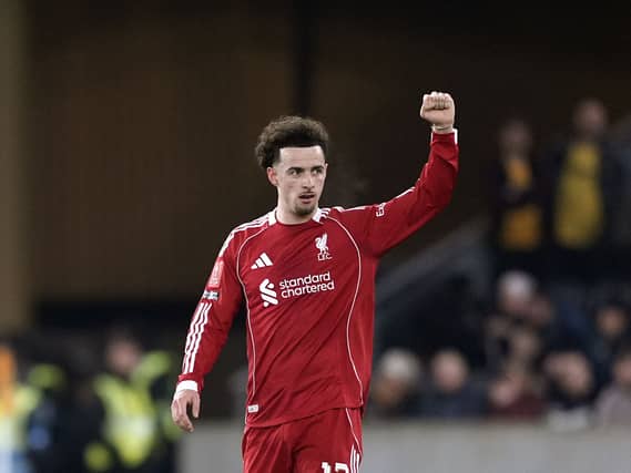 Curtis Jones raises his fist to acknowledge the Liverpool fans