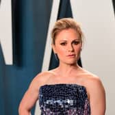Anna Paquin wearing a strapless sequin gown on the red carpet for the Vanity Fair Oscar Party.
