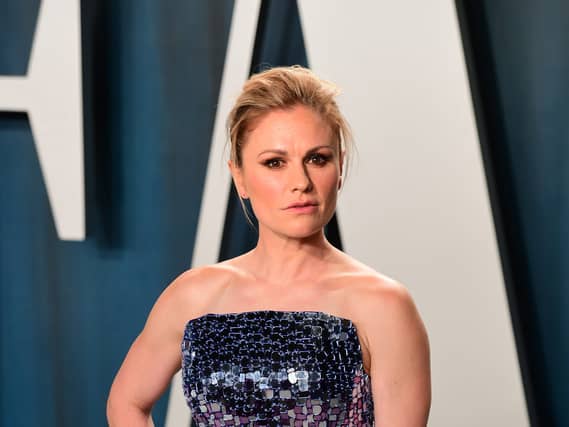 Anna Paquin wearing a strapless sequin gown on the red carpet for the Vanity Fair Oscar Party.