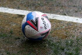 Mitre matchball on the soggy turf before the Sky Bet League Two match at the Jonny-Rocks Stadium, Cheltenham.