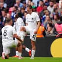 Boreham Wood's Matt Rush, right, celebrates a goal with Zak Brunt pretending to polish his boot