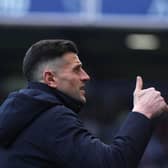 John Mousinho gives a thumbs up gesture