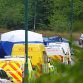 Police officers at the scene of a fatal crash involving a police car and a Volkswagen Passat on the A66 in South Bank, near Middlesbrough