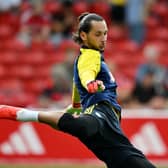 Leeds goalkeeper James Trafford warms up