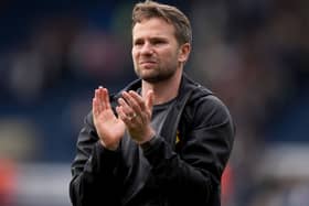 Tom Cleverley applauds the fans