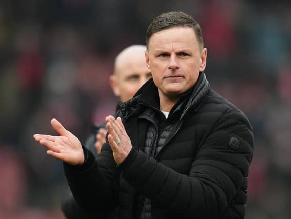 Leyton Orient manager Richie Wellens applauds the fans