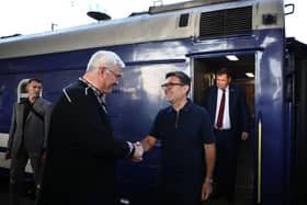 Ukraine’s foreign affairs minister Andrii Sybiha (left) welcomes Prime Minister Andy Burnham as he arrives by train in Kyiv