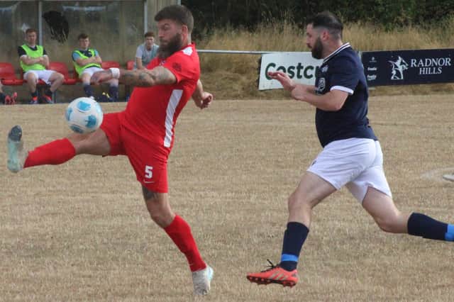The ball is cleared during Knighton Town's 1-1 draw with Llanfair United Pictures: Stuart Townsend