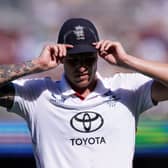 Brydon Carse cuts a dejected figure on day three of the third Ashes Test in Adelaide